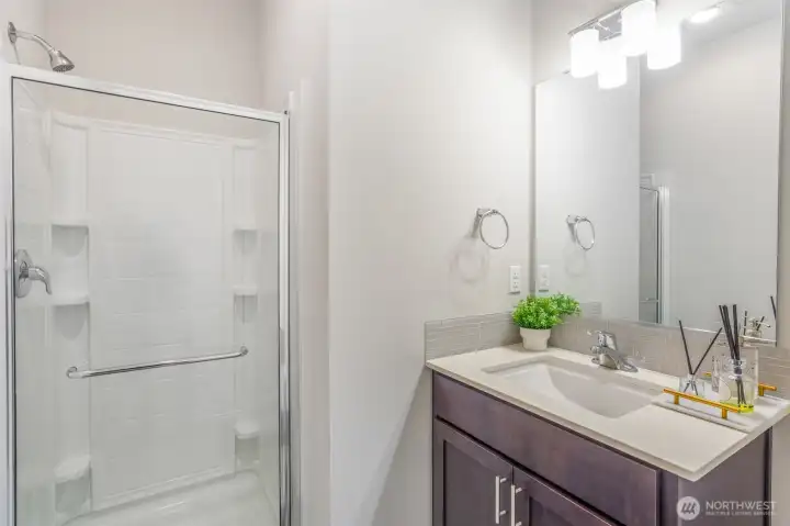 Main floor guest bathroom with shower.