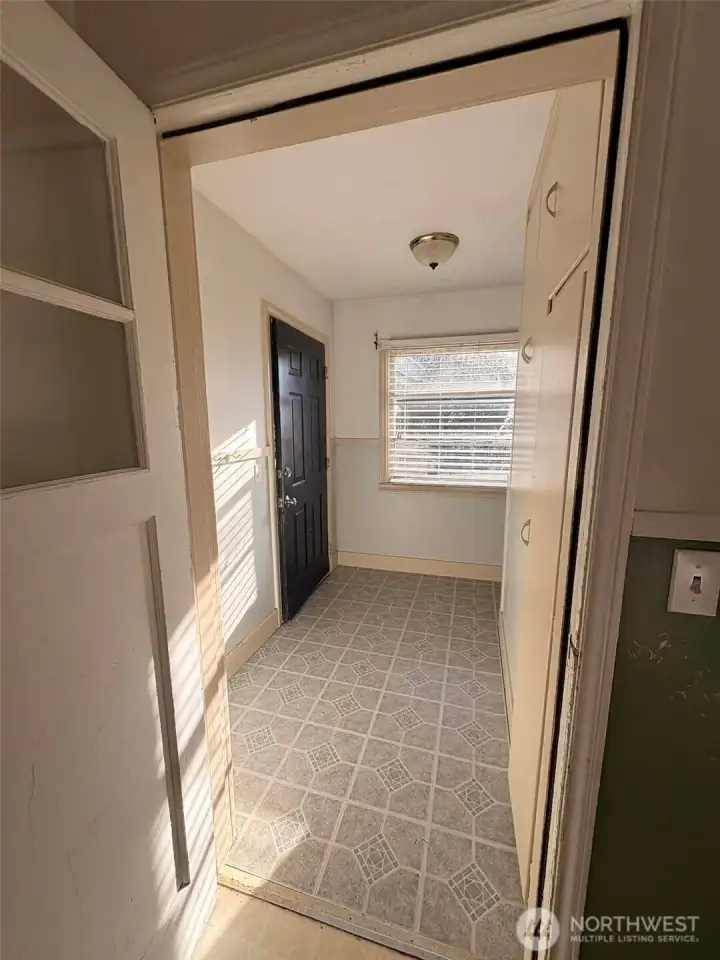 Let's check out the inside.  Coming in from side door, there is a large entry way- perfect for taking off your muck boots or galoshes or just having a great entry way.