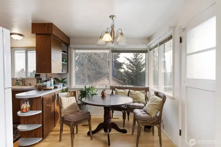 Dining area off kitchen and view of Mt. Rainier and peekaboo view of water.