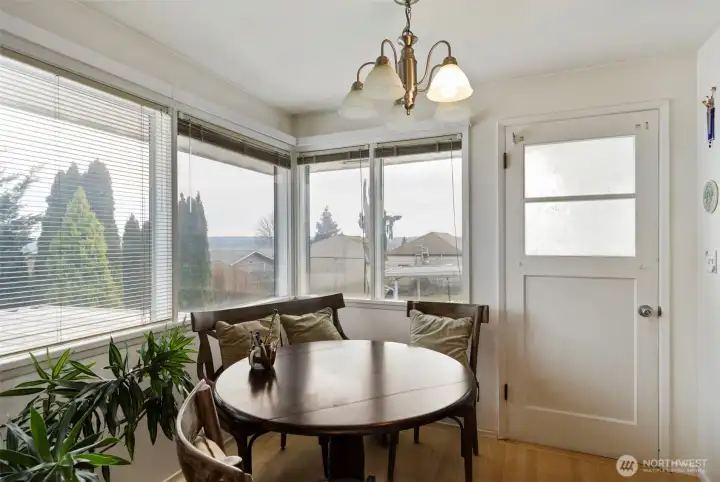 Dining area off kitchen and view of Mt. Rainier and peekaboo view of water.