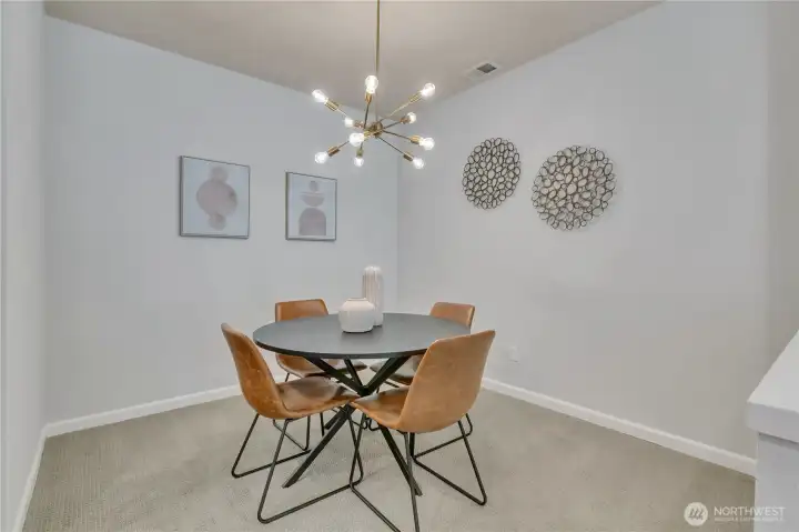 Dining room features a stylish mid-century modern Sputnik chandelier.