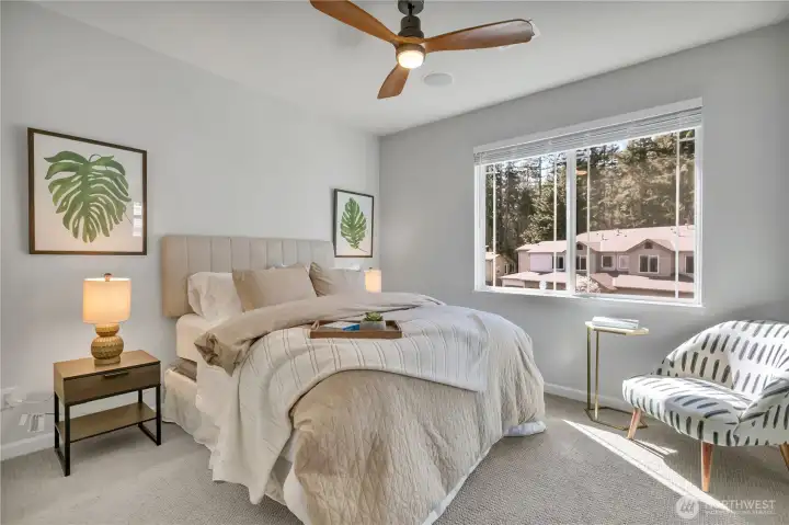 Primary bedroom offers a spacious layout and a large walk-in closet.