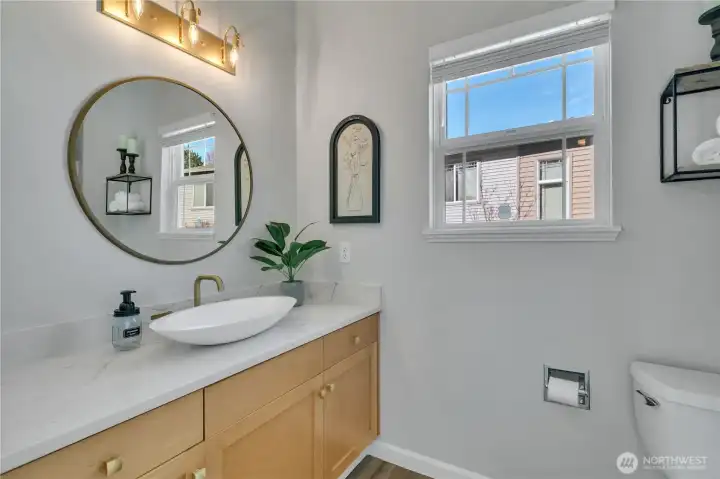 Bathrooms feature above-counter vessel sink vanities for a modern touch.