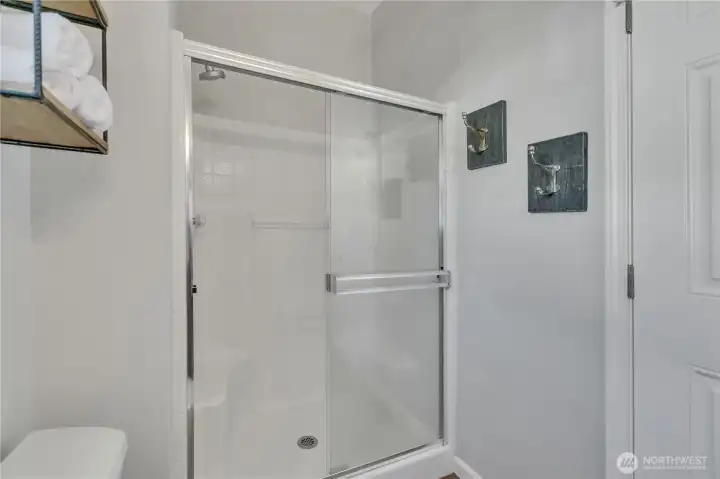 Primary bathroom features a convenient standalone shower.