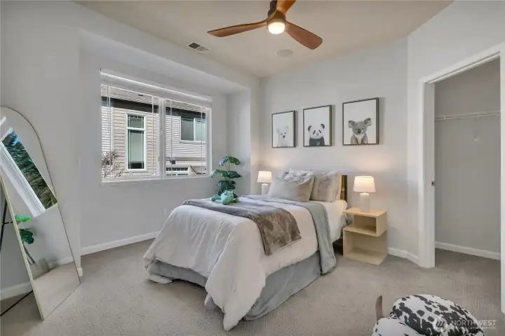 Second bedroom offers flexibility as a home office and includes a walk-in closet.