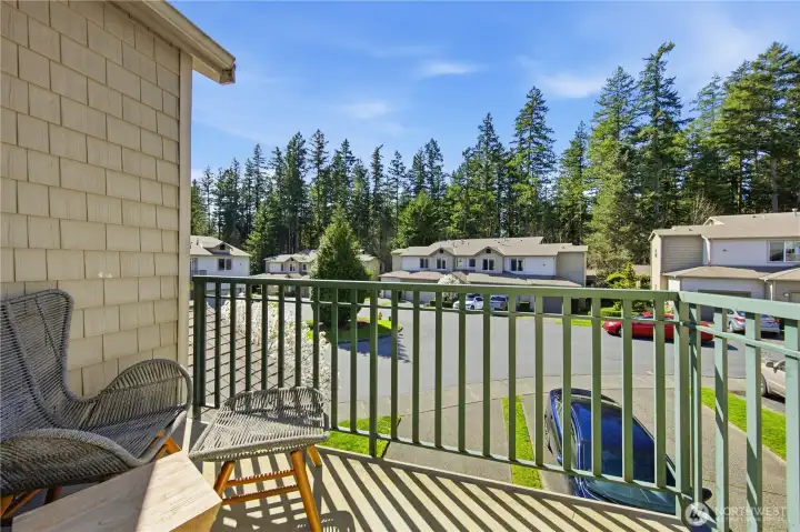 Front of home includes a balcony, offering a cozy outdoor space to enjoy fresh air and neighborhood views.
