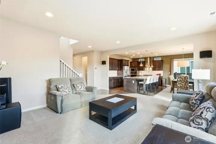 Easy access to the kitchen makes this space an ideal gathering spot for all members of the household.