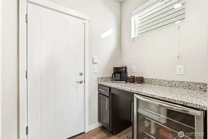 Don't miss the custom coffee bar and doggie door just below the counter!