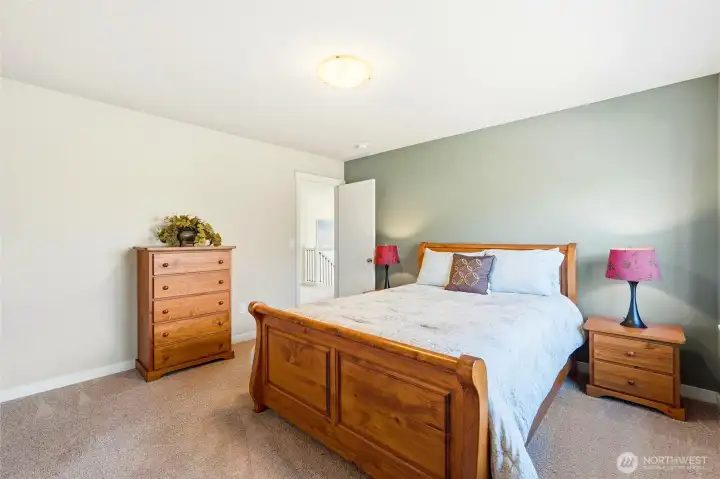 Two additional bedrooms sit upstairs with a closet or bath in between all of them for noise dampening.