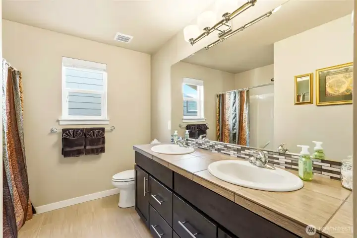 The upstairs guest bath leaves plenty of room for sharing.