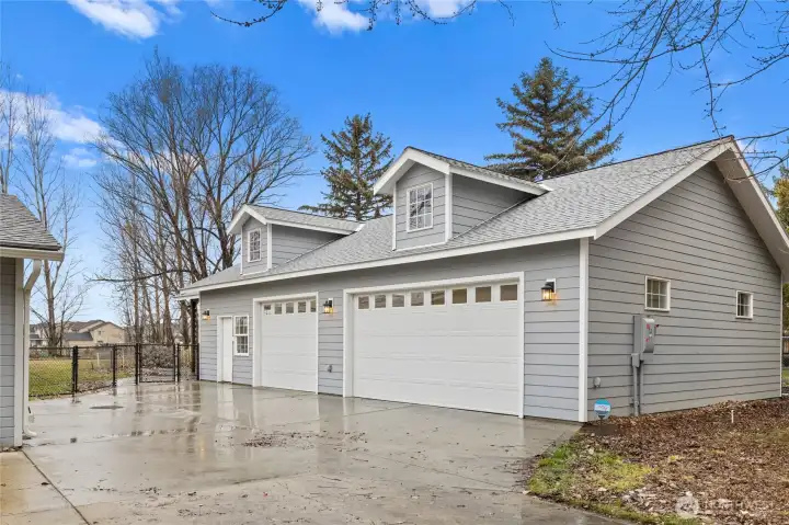 insulated & heated three-car garage  + EV charging capabilities