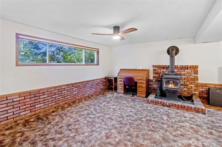 Another view of the lower level rec room highlighting the expansive layout.