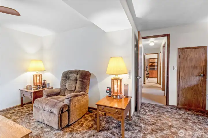 Another view of the expansive downstairs rec room highlighting flexible living space.