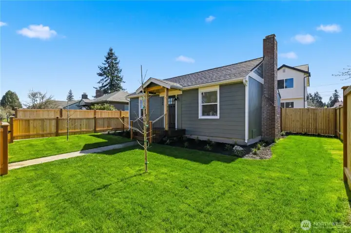 Spacious, fully fenced yard with level lawn