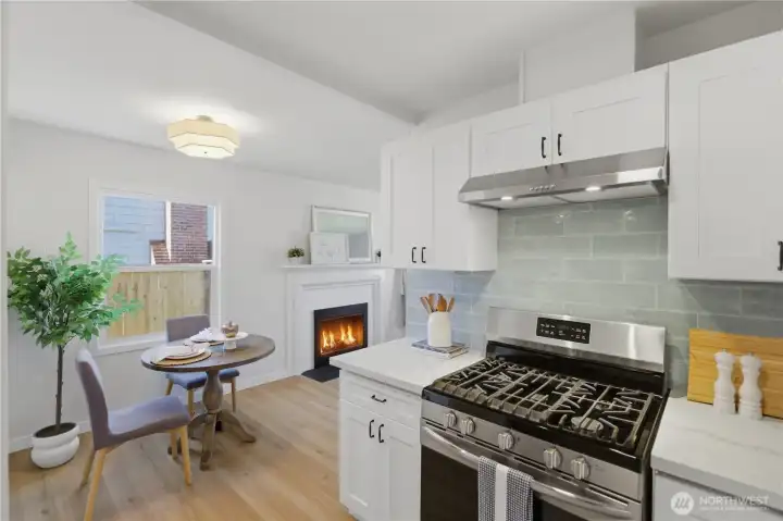 Kitchen with gas range and direct connection to living space