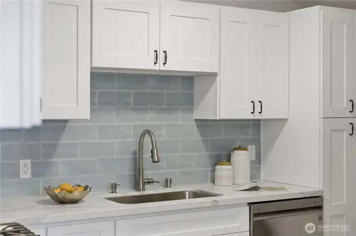 Updated kitchen with tile backsplash and modern fixtures