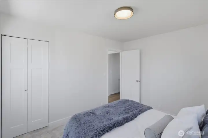 Primary bedroom with closet and functional layout