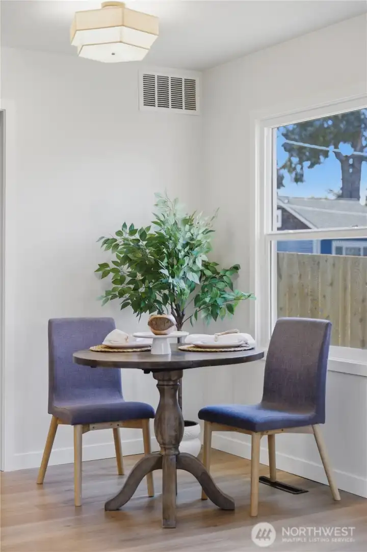 Dedicated dining nook with bright window and inviting feel