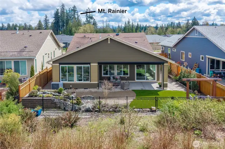 Gorgeous and low maintenance backyard. high-end turf, impressive water feature with landscape lighting. You will delight sitting out here day or night!  Expansive Western exposure, extremely private, amazing sunsets.  Sunshades on both sided of the patio and the primary bedroom.