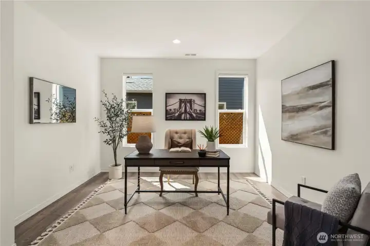 French doors open to the generous den with Engineered hardwoods & blackout shades.