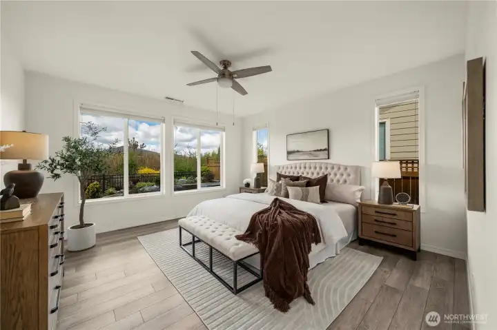 The primary bedroom boasts of Engineered hardwoods, blackout shades & remore ceiling fan w/ light.
