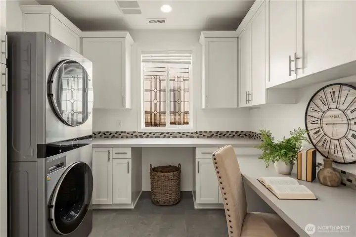 The laundry room/mud room/ Smart space offers extra storage and a work or craft space!