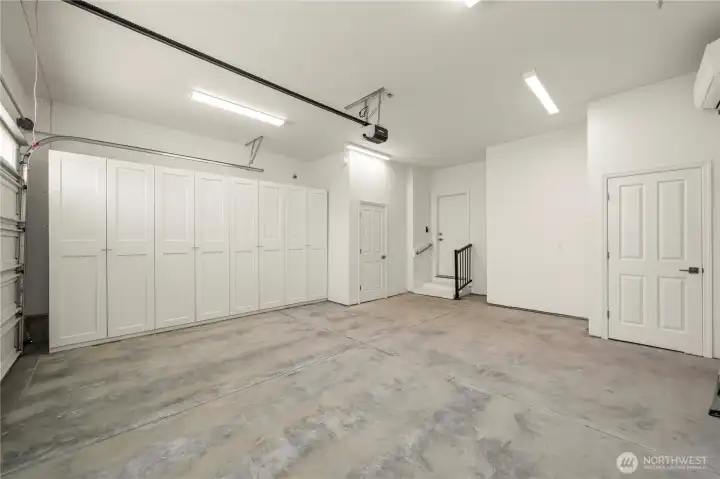 Finished two car garage with custom built-in storage, a garage service door (with a storm door) & fully insulated.