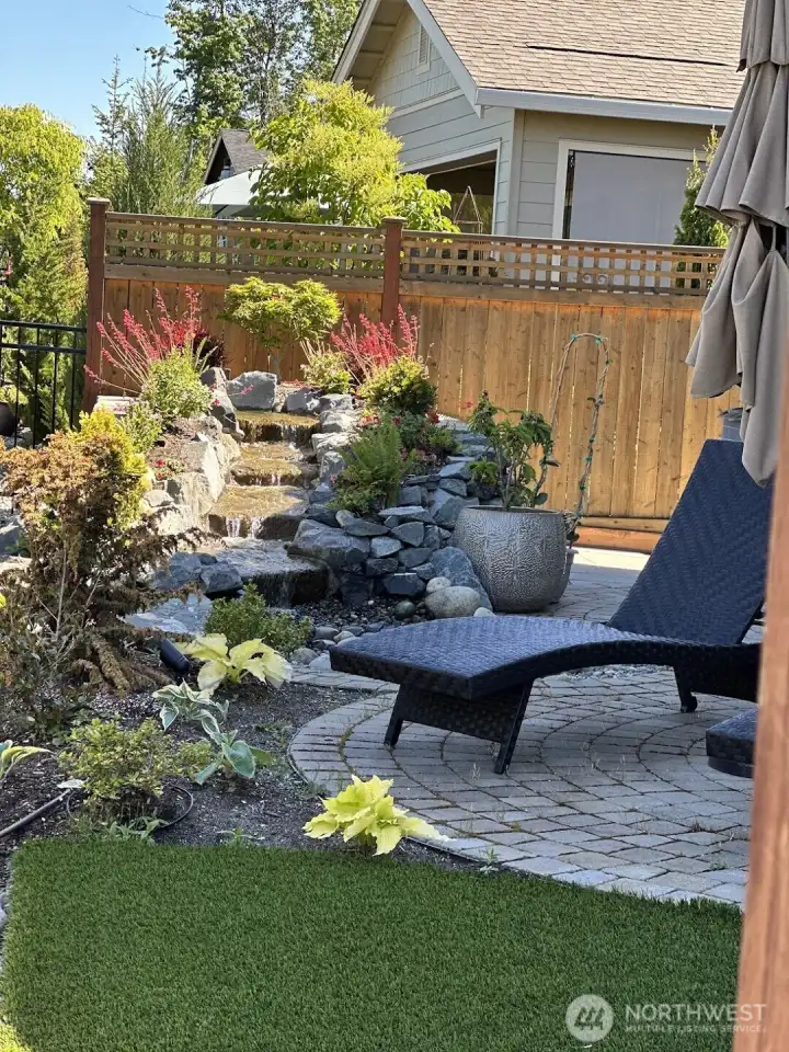 Relax by the soothing water feature while looking over the broad expanse to the West.