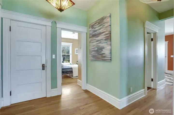 A storage closet is set right across the hall from the dining room. Notice the doorway into the 2nd bedroom, and a door into the 2nd 3/4 bath from the hall as well.