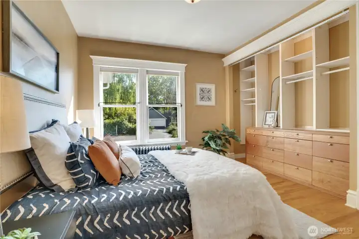 This 2nd bedroom includes a built-in dresser and a laundry hookup for a stackable washer-dryer set in the closet near the bathroom door.