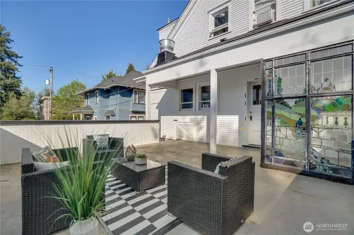 Come straight out from the kitchen or take the stairs up from the yard below. Imagine giant pots full of flowers, tomatoes and herbs in every corner of this back deck.