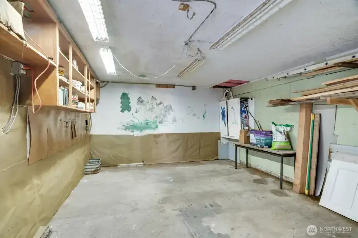 The deck is set atop a garage building used more recently as a workshop-storage room.