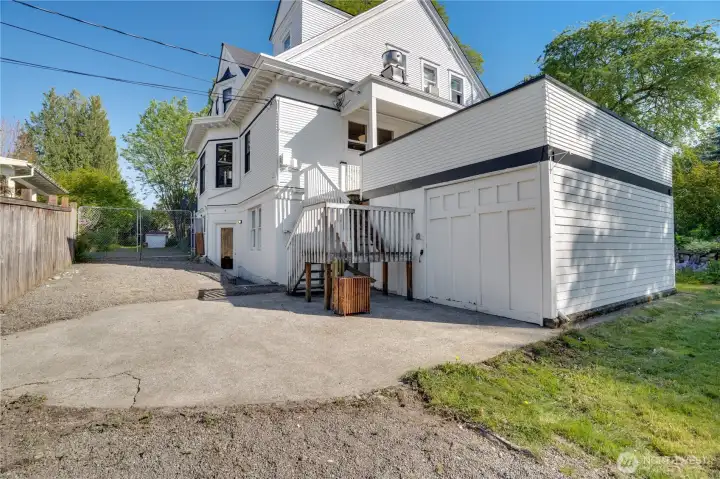 Come down the stairs from the deck to reach the garage/storage building, and to visit the basement studio apartment.