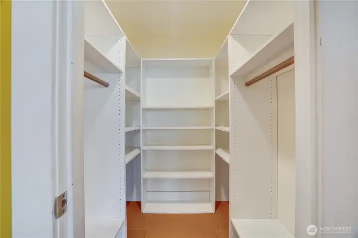 The studio's walk-in closet is complete with shelving to keep clothes and other items organized and out of the way.