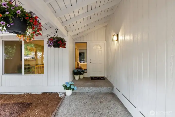 This covered entry graciously welcomes you. There is one step to get into this house - you truly can live on one level!