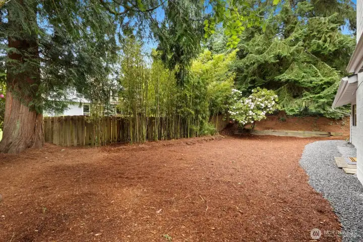Backyard is level and ready for your vision. Probably the perfect spot for turf!