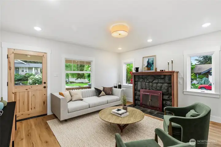 Living room with wood burning fireplace. Living room with wood burning fireplace.