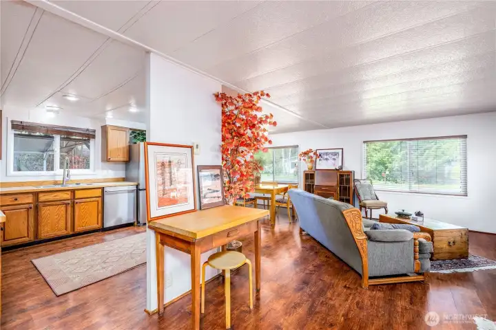 Cozy wood details in flooring and cupboards with an open layout for functionality.
