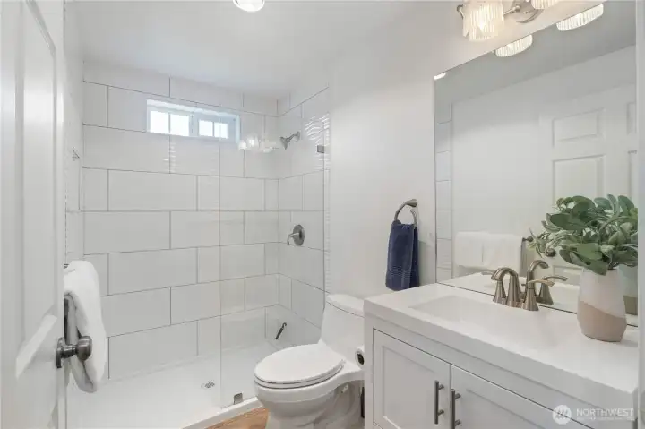 Beautifully updated main floor bathroom with walk-in shower