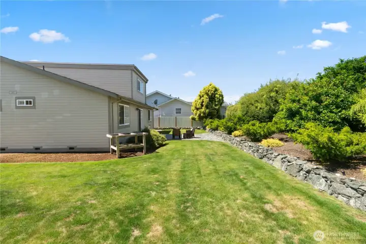 Just the right amount of grassy lawn, privacy and garden space