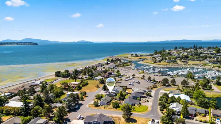 Just steps from the marina, parks and private community beaches