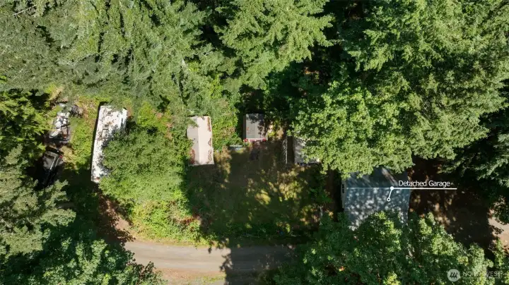 Detached garage, shed and garden area. Detached garage, shed and garden area.