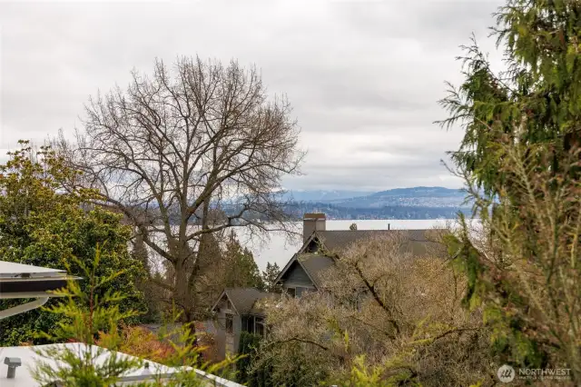 Primary suite features a balcony with lake & mountain views.
