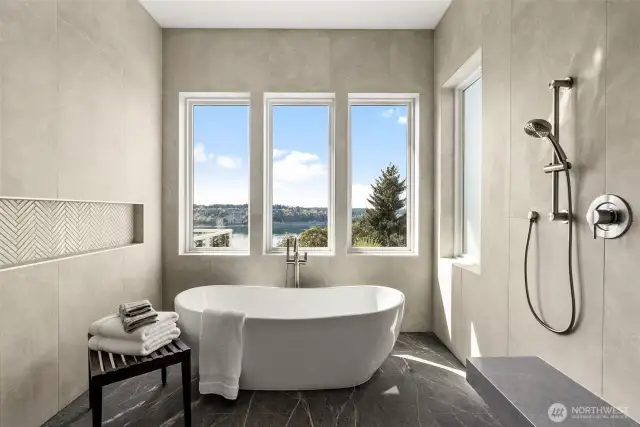 A closer look at the spa-inspired wet room reveals a deep soaking tub and a beautifully tiled rain shower—designed for ultimate relaxation and refined style.