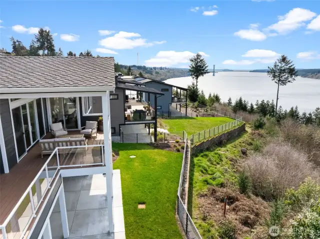 Soaking in the sun on the expansive west-facing deck, with breathtaking views of the Puget Sound and the iconic Narrows Bridge.  A perfect place to unwind and take in golden hour.