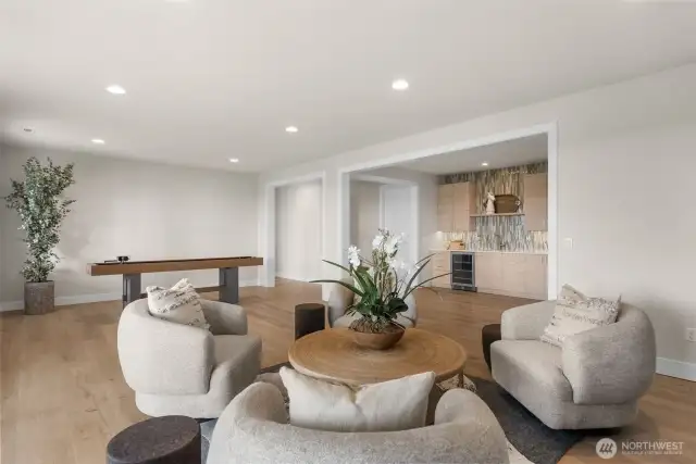 Downstairs offers expansive entertainment space, perfect for large family gatherings or events. With plenty of room for everyone, guests will never feel crowded.