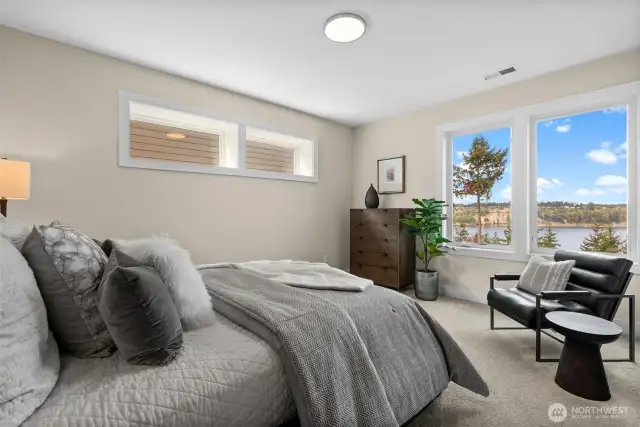 The second guest suite downstairs offers complete privacy, featuring a private bathroom, a full closet system, and fantastic views—making it an ideal retreat for guests.