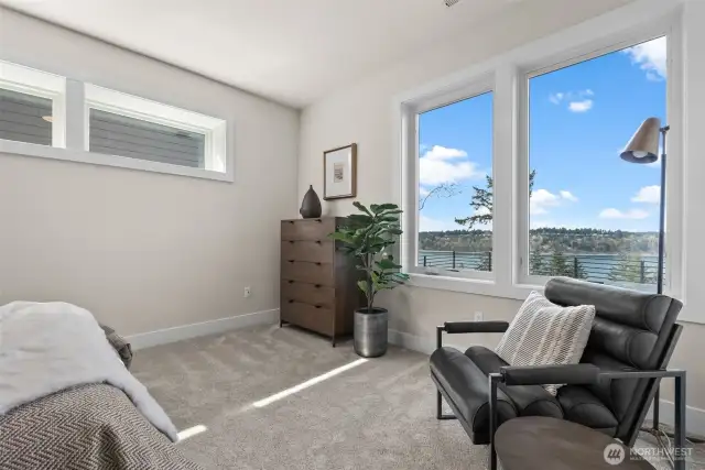 The second guest suite downstairs offers complete privacy, featuring a private bathroom, a full closet system, and fantastic views—making it an ideal retreat for guests.