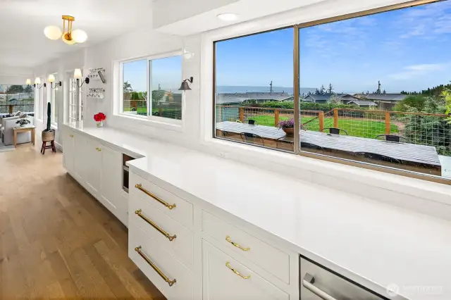 Ample counter space with beautiful, durable, and low maintenance quartz countertops, including area for coffee bar