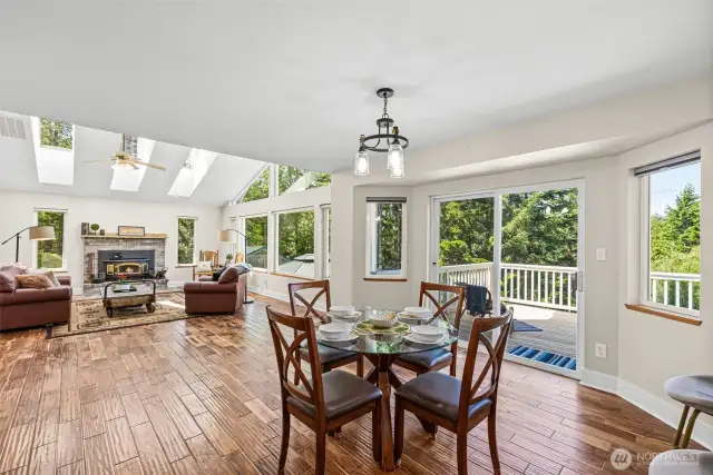 Open concept flow from kitchen to living room with access to back deck. informal dining space.